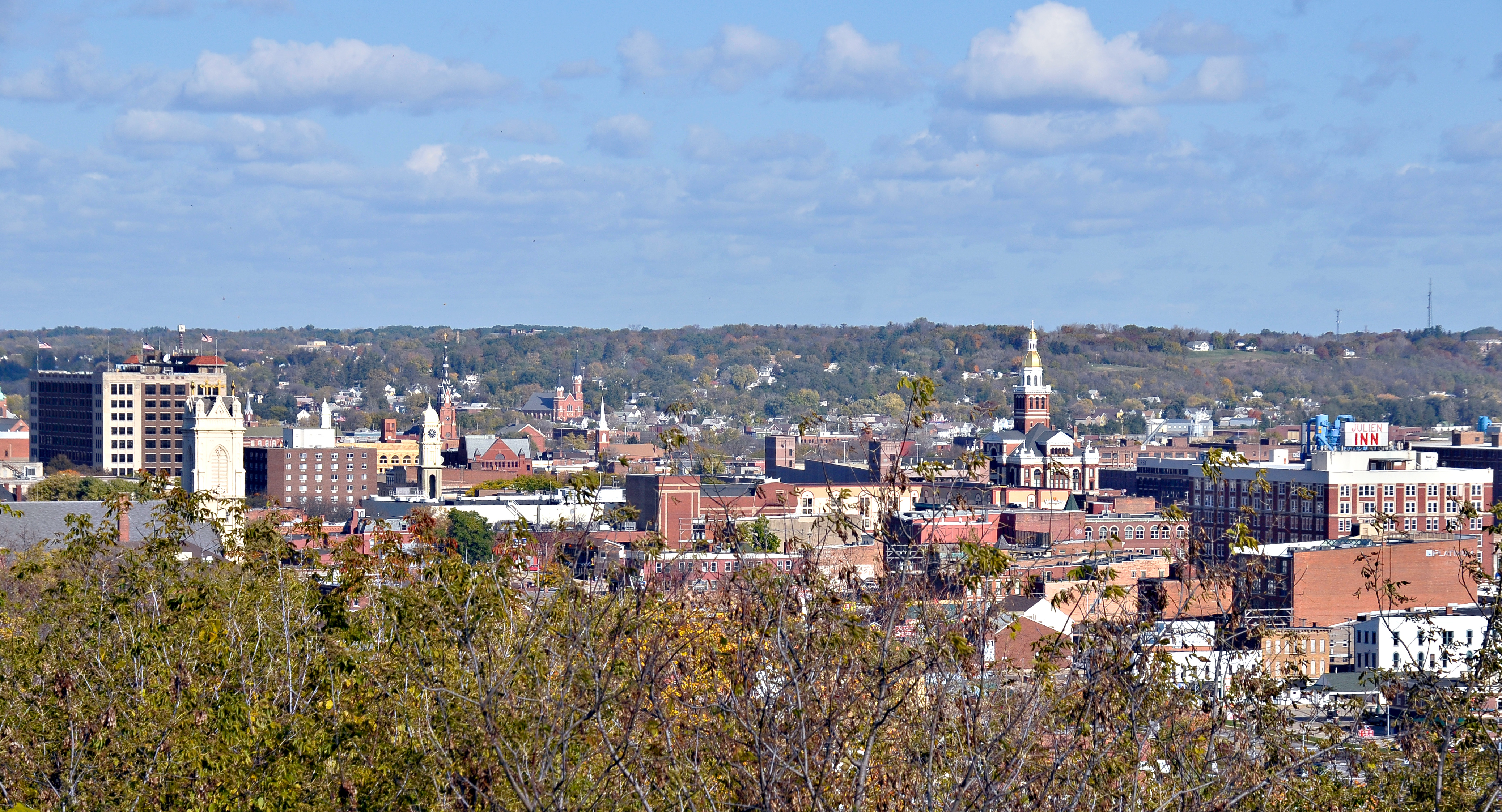 Dubuque ( , dəb-YOOK) is a city in and the county seat of Dubuque County, Iowa, United States, located along the Mississippi River. At the time of the 2020 census, the population of Dubuque was 59,667. The city lies at the junction of Iowa, Illinois, and Wisconsin, a region locally known as the Tri-State Area. It serves as the main commercial, industrial, educational, and cultural center for the area. Geographically, it is part of the Driftless Area, a portion of North America that escaped all three phases of the Wisconsin Glaciation.
Dubuque is a regional tourist destination featuring the city's unique architecture, casinos and river location. It is home to five institutions of higher education. Dubuque has historically been a center of manufacturing, the local economy also includes health care, publishing, and financial service sectors.