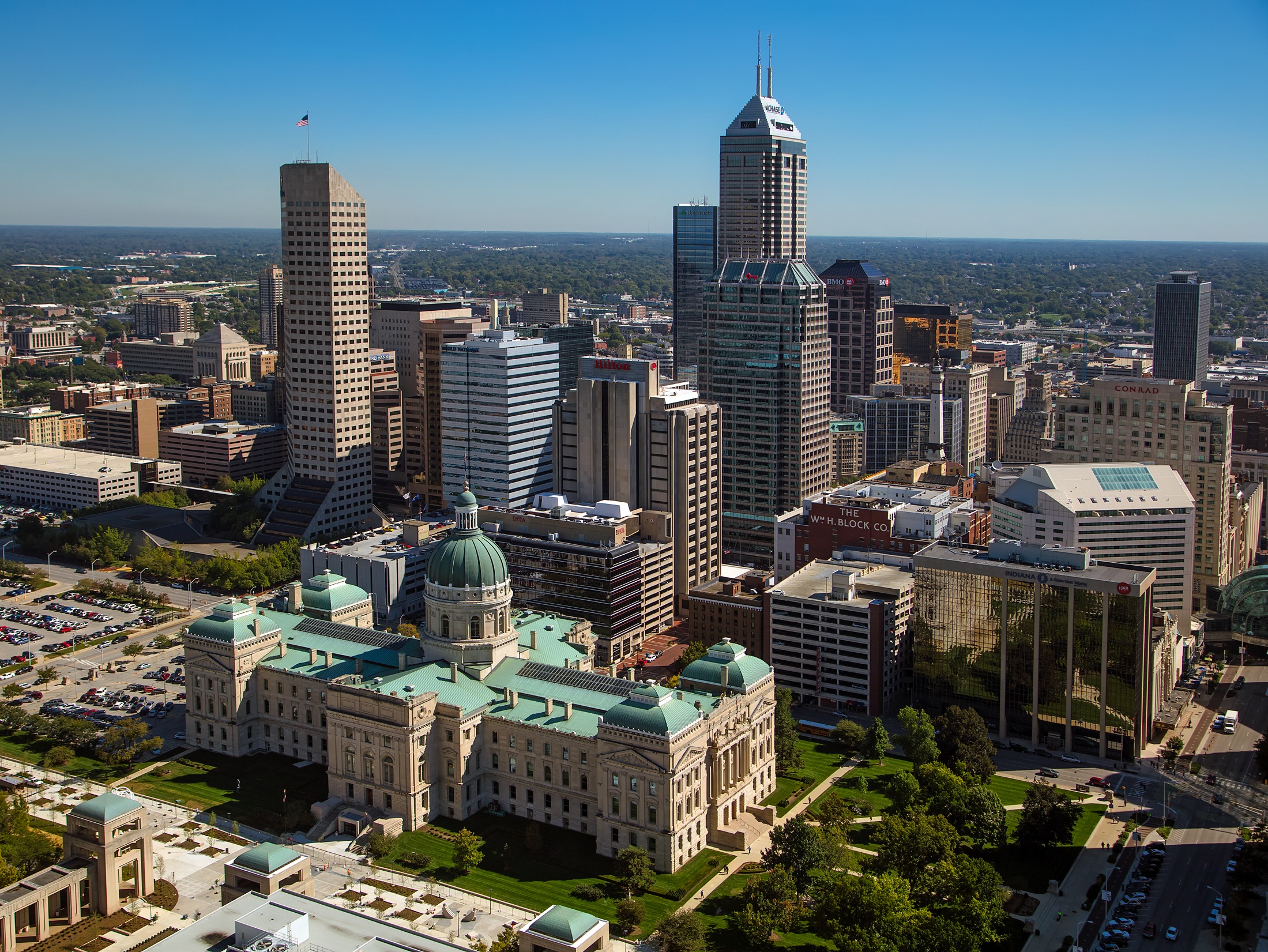 Indianapolis ( IN-dee-ə-NAP-ə-lis), colloquially known as Indy, is the capital and most populous city of the U.S. state of Indiana and the seat of Marion County. Located in Central Indiana, the city lies along the White River's West Fork near its confluence with Fall Creek.
At the 2020 census, the balance population was 887,642. Indianapolis is the 16th-most populous city in the U.S., the third-most populous city in the Midwest after Chicago and Columbus, Ohio, and the fourth-most populous state capital after Phoenix, Arizona, Austin, Texas, and Columbus. The Indianapolis metropolitan area is the 34th-most populous metropolitan statistical area in the U.S., home to 2.1 million residents. With a population of more than 2.6 million, the combined statistical area ranks 27th. Indianapolis proper covers 368 square miles (950 km2), making it the 18th-most extensive city by land area in the country.
Indigenous peoples inhabited the area dating to as early as 10,000 BC. In 1818, the Lenape relinquished their tribal lands in the Treaty of St. Mary's. In 1821, Indianapolis was founded as a planned city for the new seat of Indiana's state government. The city was platted by Alexander Ralston and Elias Pym Fordham on a 1-square-mile (2.6 km2) grid. Completion of the National and Michigan roads and the arrival of rail later solidified the city's position as a manufacturing and transportation hub. Two of the city's nicknames, the "Crossroads of America" and "Railroad City", reflect the city's historical ties to transportation. Since the 1970 city-county consolidation, known as Unigov, local government administration operates under the direction of an elected 25-member city-county council headed by the mayor.
Indianapolis anchors the 30th largest metropolitan economy in the U.S., based primarily on the industries of trade, transportation, and utilities; professional and business services; education and health services; government; leisure and hospitality; and manufacturing. The city has notable niche markets in amateur sports and auto racing. Indianapolis is home to three Fortune 500 companies, two major league sports teams (the Colts of the NFL and the Pacers of the NBA), five university campuses, and several museums, including the world's largest children's museum. The city is perhaps best known for annually hosting the world's largest single-day sporting event, the Indianapolis 500. Among the city's historic sites and districts, Indianapolis is home to the largest collection of monuments dedicated to veterans and war casualties in the U.S. outside of Washington, D.C.